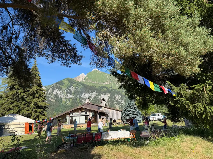 The retreat site: yurt and chalets facing the mountains