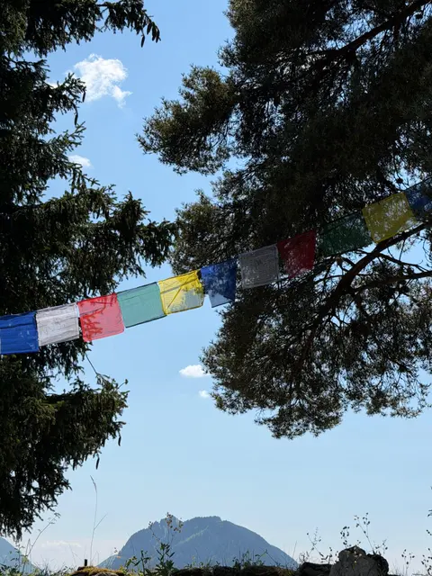Prayer flags floating above the camp