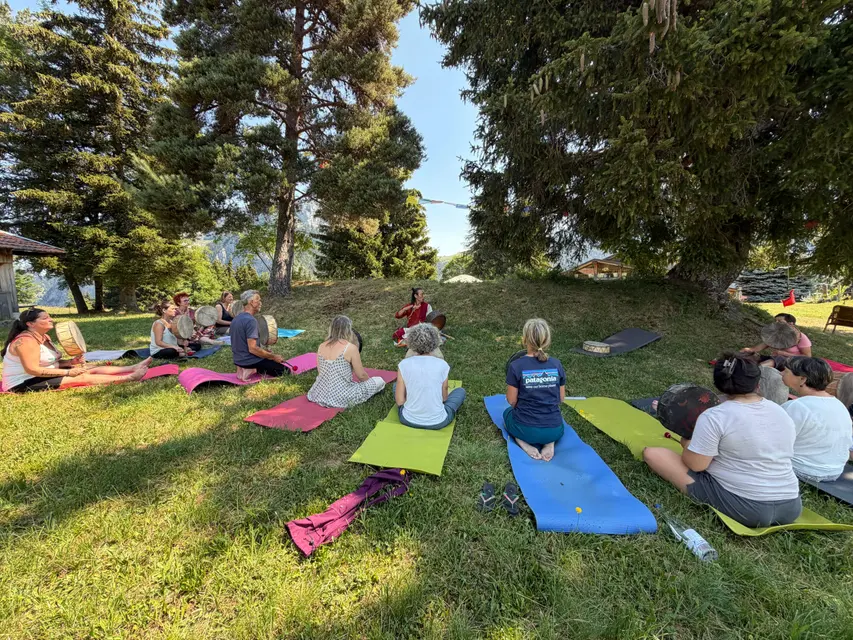 Group session in the mountain pastures during a retreat