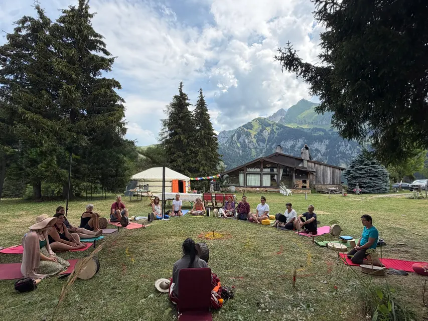 Group session in the mountain pastures during a retreat