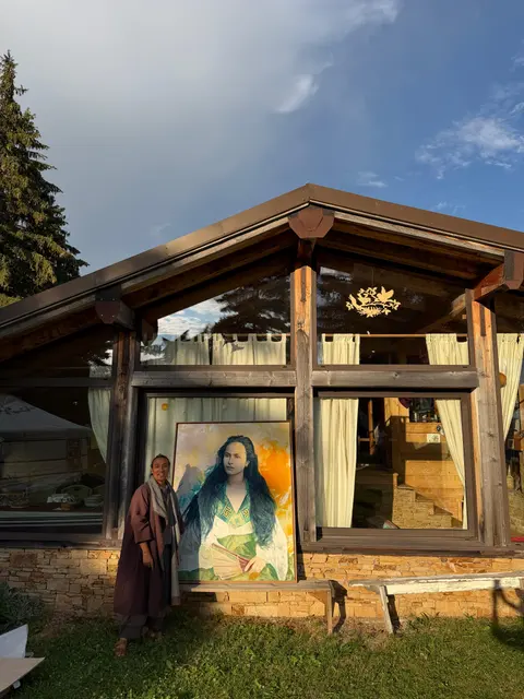 The retreat site: yurt and chalets facing the mountains