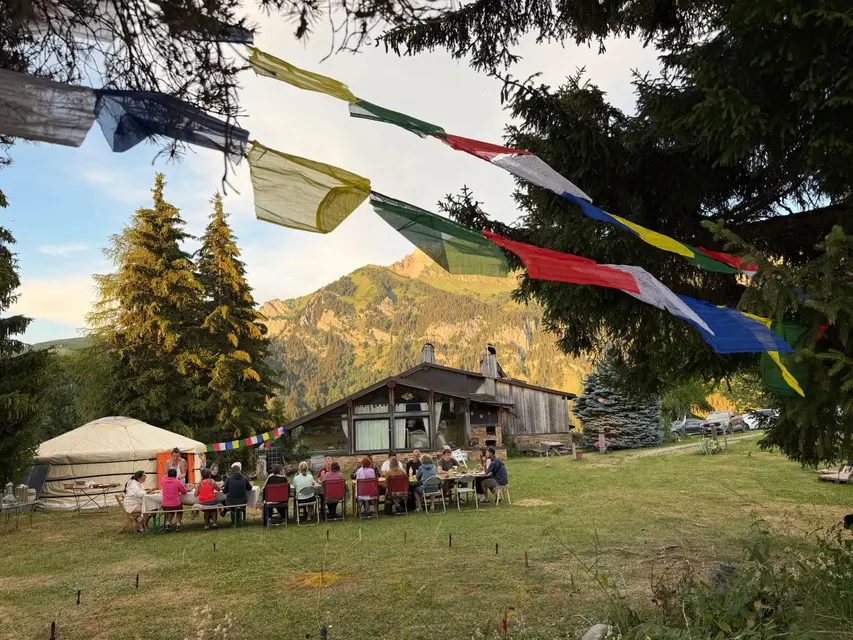 Prayer flags floating above the camp