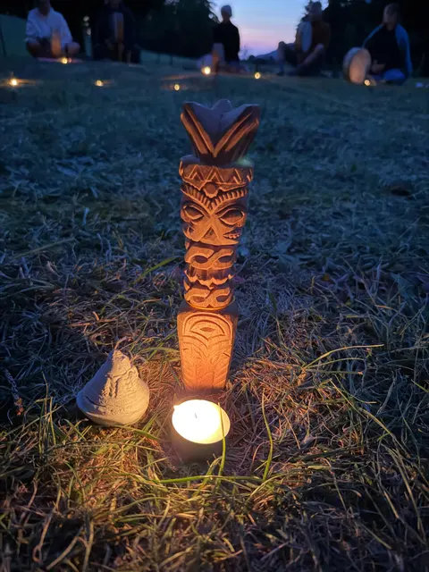 Night ceremony in a circle of candles