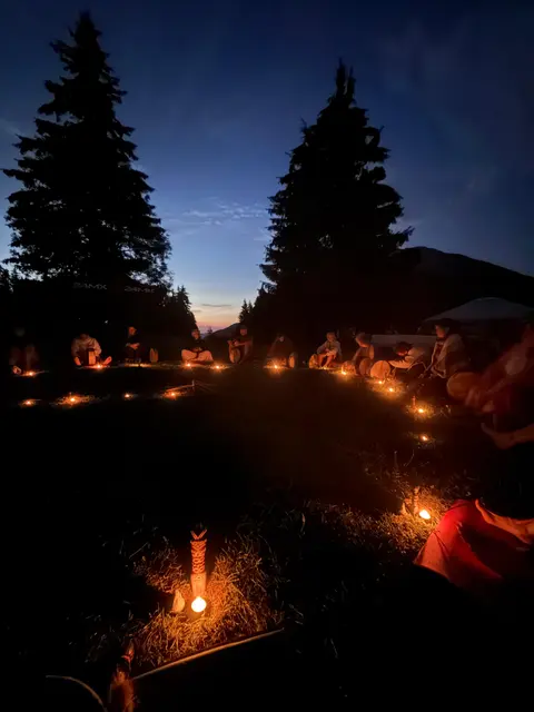 Night ceremony in a circle of candles