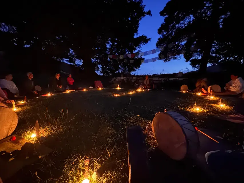 Night ceremony in a circle of candles